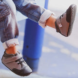 A close-up view of gray Emmerson children's barefoot shoe by Jack & Lily