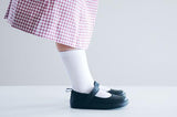 A side profile of a toddler wearing a pair of Atlas shoes by PaperKrain
