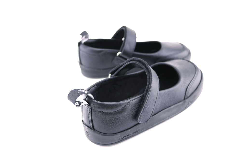 The back of a black pair of PaperKrane's Atlas children's barefoot shoe